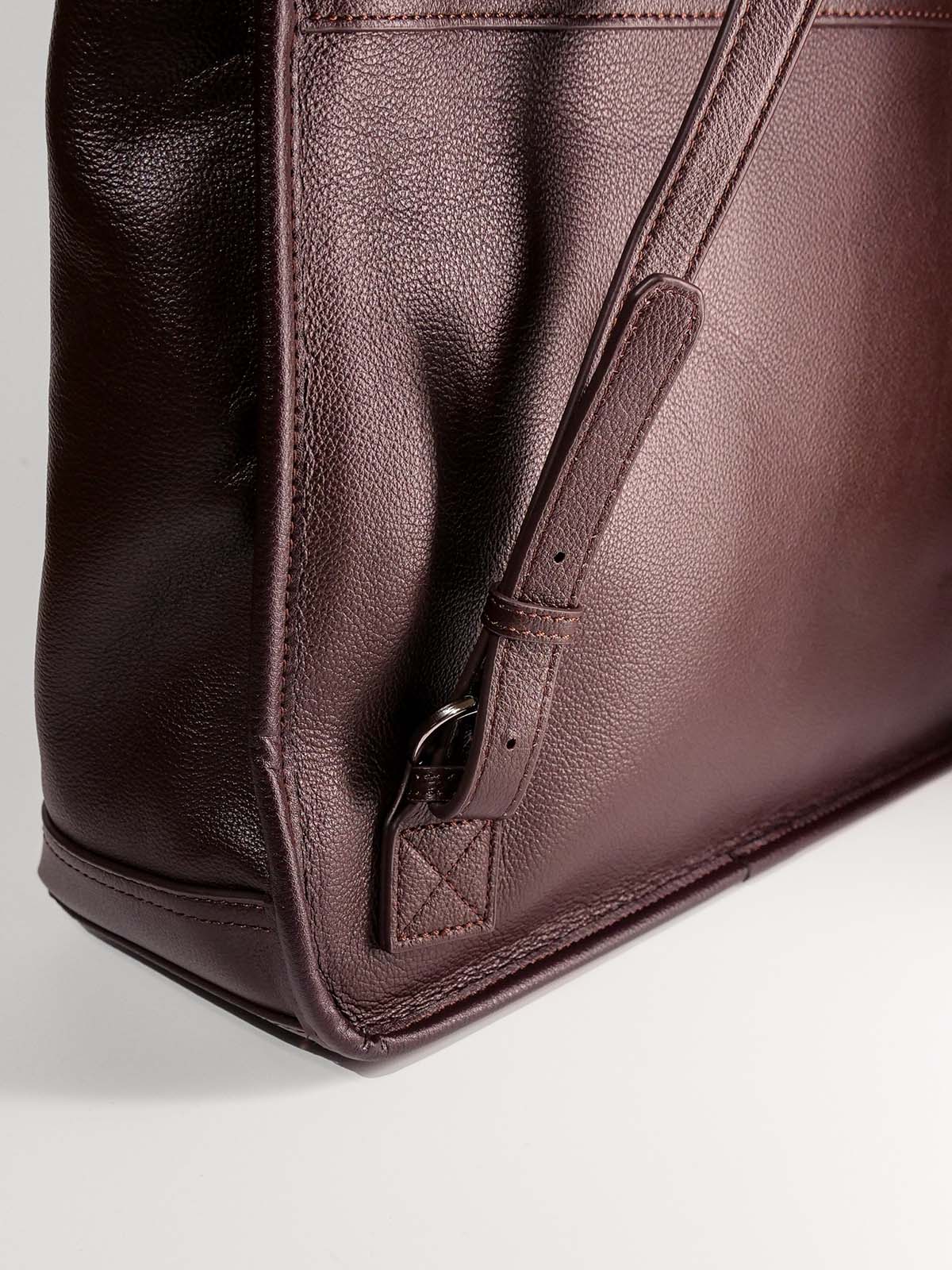 Brown Amari top grain leather backpack close up adjustable buckle strap