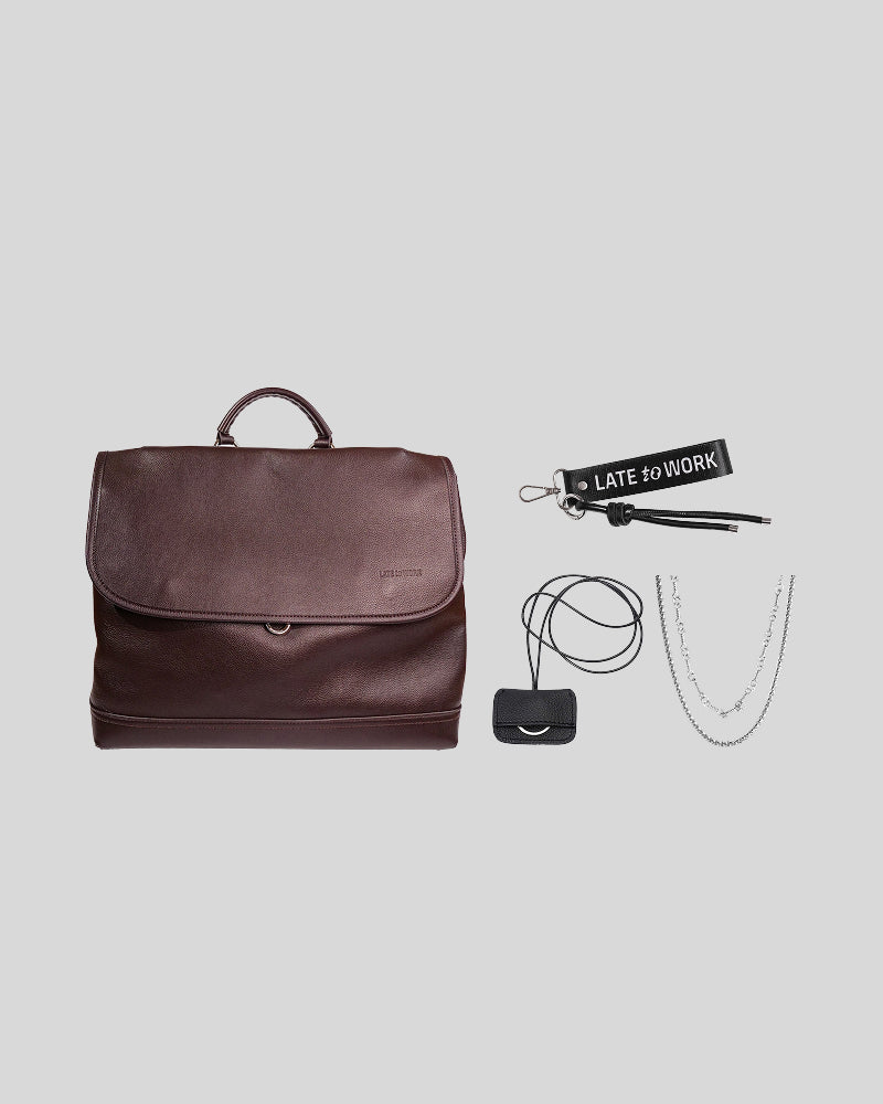 Brown Amari Backpack bundle featuring the bag, Late Knot Charm, Beni Key Tag and Annick Necklace