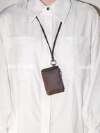 Brown leather Aspen pouch worn as a necklace
