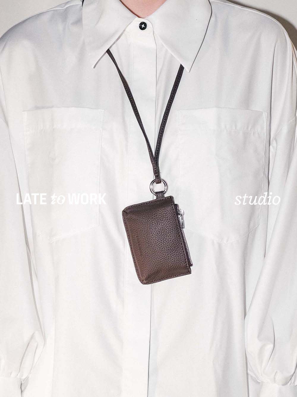 Brown leather Aspen pouch worn as a necklace
