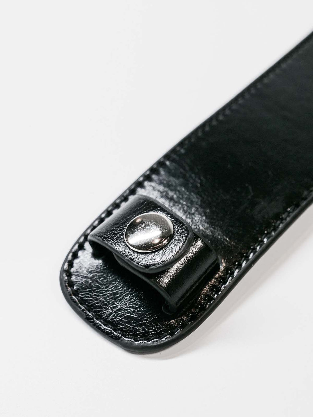 Close up of shoulder pad button