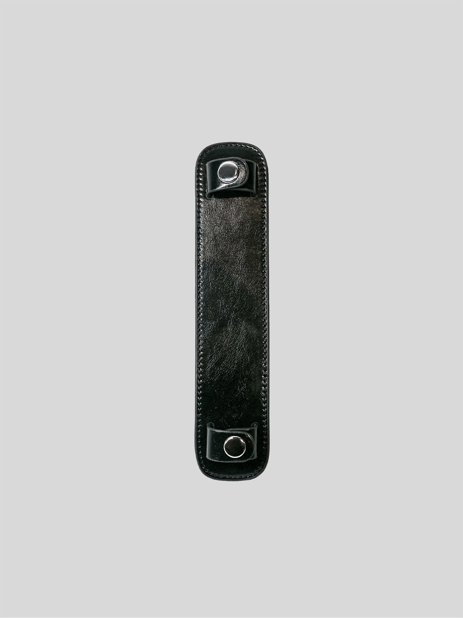 Black patent leather bag strap shoulder pad