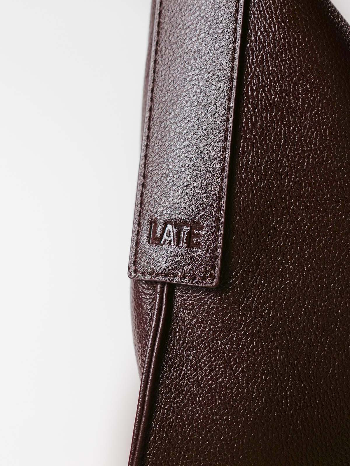 Close up of Luxe Kite Bag strap with 'LATE' embossed