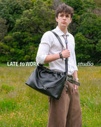 Sage crossbody bag black genuine leather  worn on shoulder