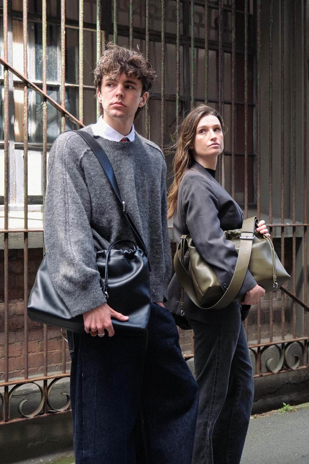 Sage Bag genuine leather crossbody bag worn by two models outdoors