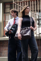 Sage crossbody bag black and brown genuine leather worn by two models