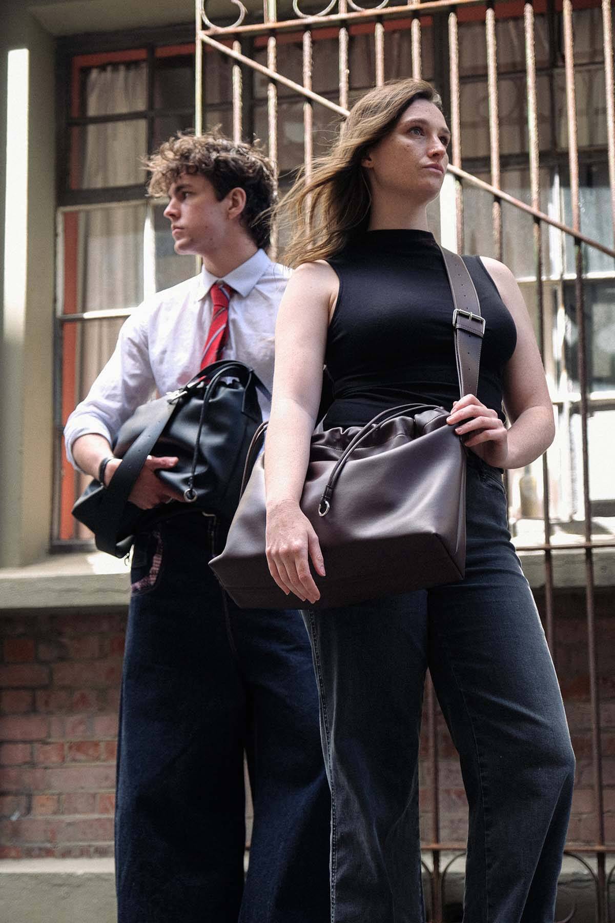 Sage crossbody bag black and brown genuine leather worn by two models
