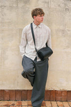 Black Fromont top grain leather crossbody bag worn crossbody