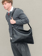 Kite Luxe top grain leather crossbody worn on the shoulder