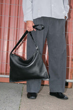 Kite Luxe top grain leather crossbody held by strap