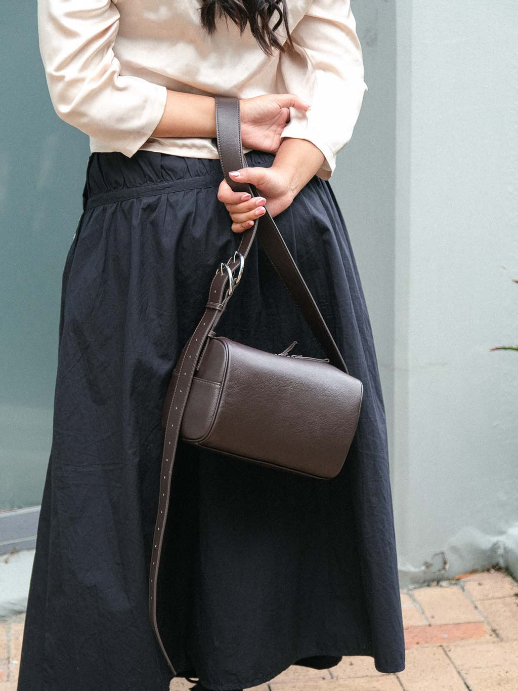 Brown Fromont Bag top-grain leather held by the strap