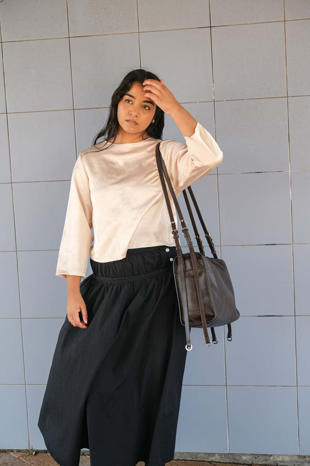 Brown Willow Bag worn on one shoulder