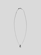 Faye stainless steel necklace on plain background