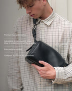 Black Fromont top grain leather crossbody bag worn crossbody on front