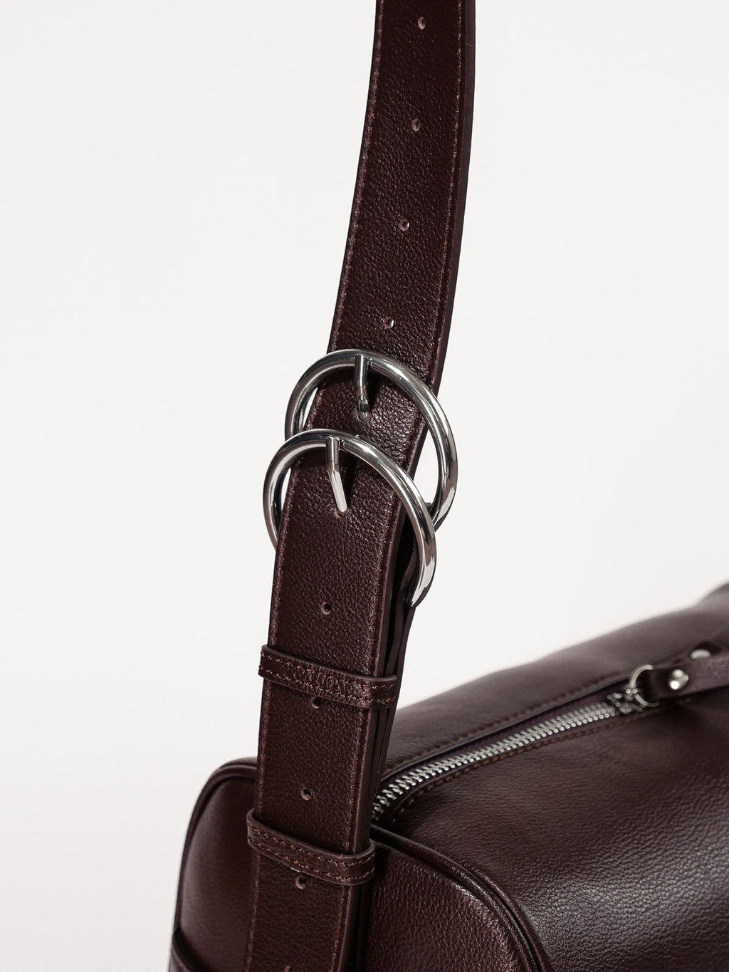 Brown Fromont crossbody bag top-grain leather strap hardware close up