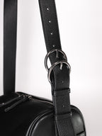 Black Fromont top grain leather crossbody bag strap hardware close up