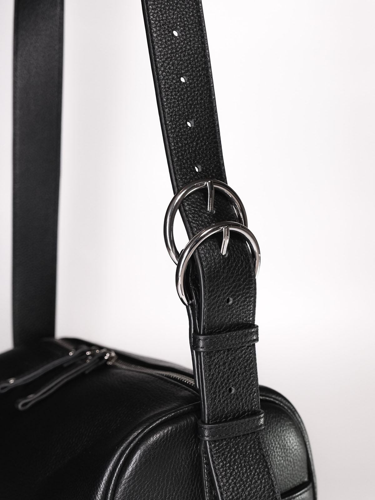 Black Fromont top grain leather crossbody bag strap hardware close up