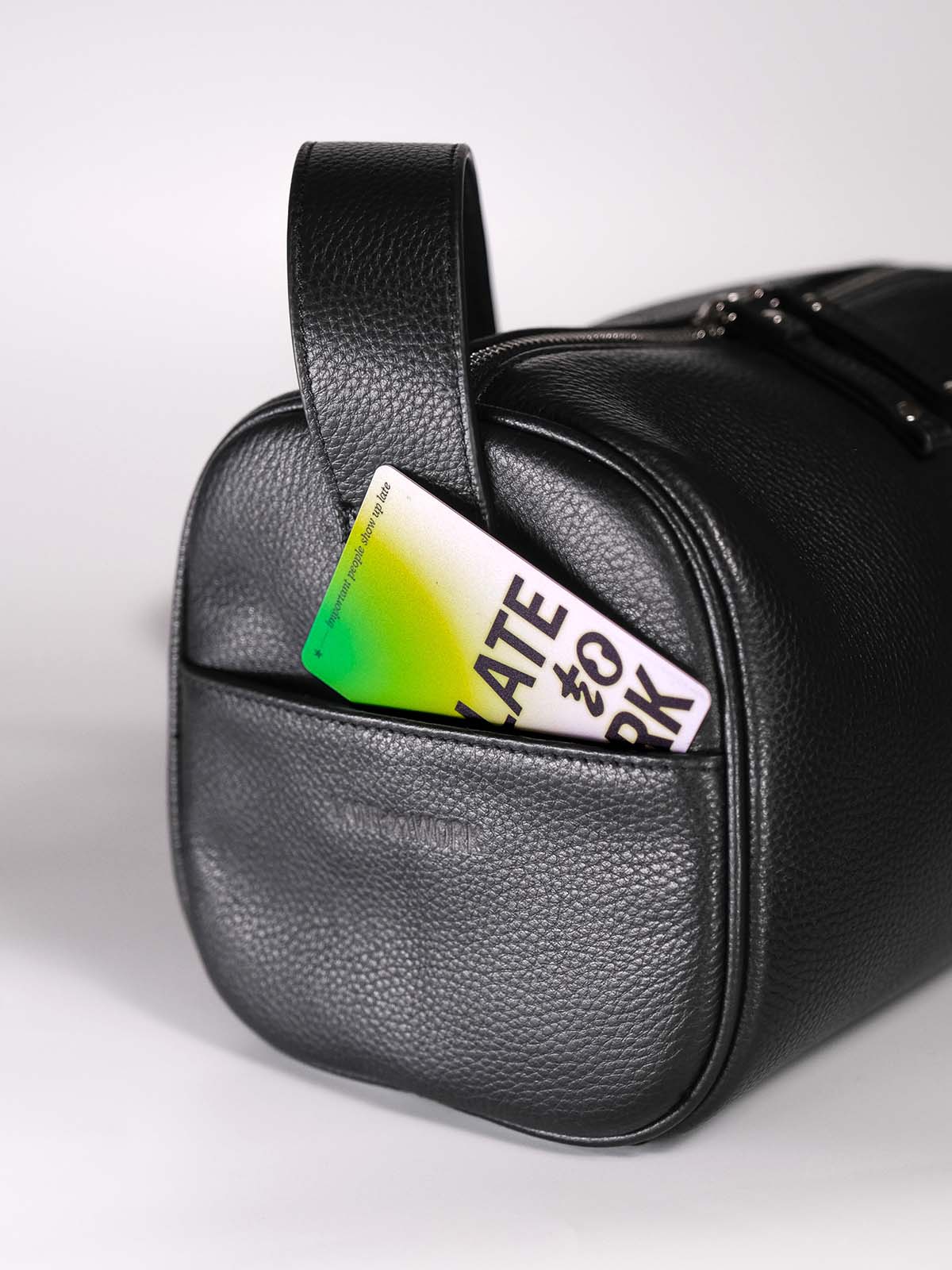 Black Fromont top grain leather crossbody bag side pocket close up