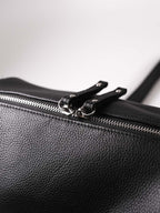 Black Fromont top grain leather crossbody bag zip closure close up