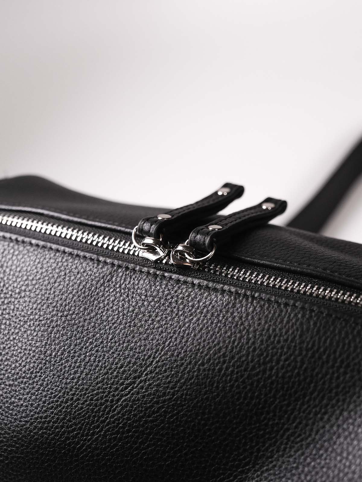 Black Fromont top grain leather crossbody bag zip closure close up