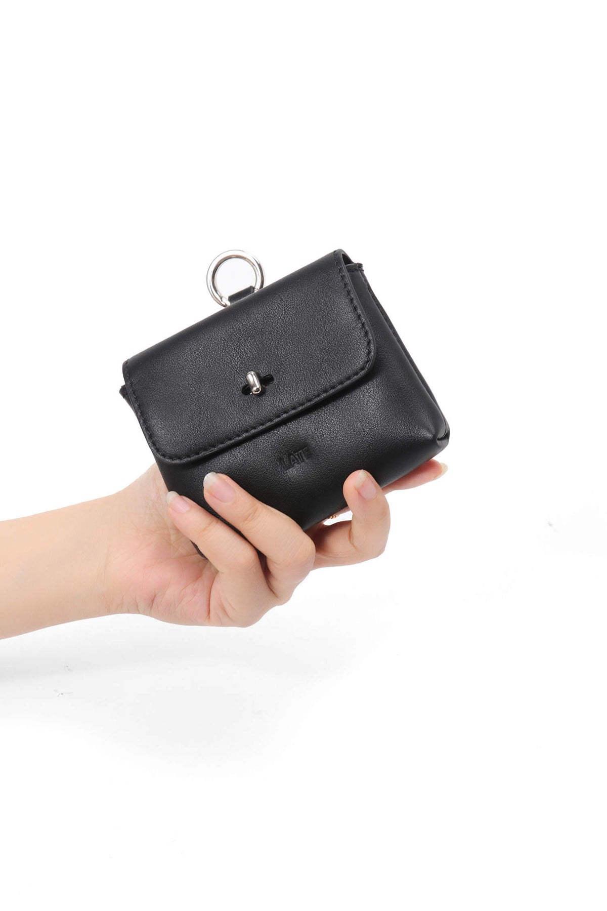 Finlay mini leather bag charm black held in hand