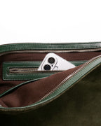 Close up of interior pocket in the forest medium Kite Bag showing an iPhone inside
