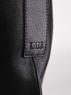 Kite Luxe top grain leather crossbody embossed logo close up