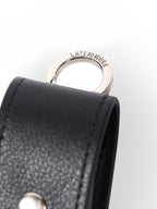 Leather lip balm case close up on metal hardware