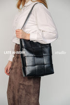 Marcello black crossbody genuine patent leather bag worn on shoulder