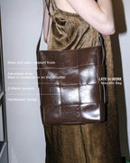 Marcello Brown crossbody genuine patent leather bag worn on shoulder