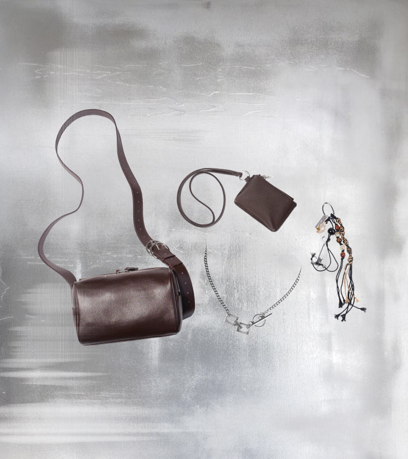 Limited edition bundle showing Brown Fromont Bag, Aspen Leather Pouch, Laifa Necklace and Autumn Charm