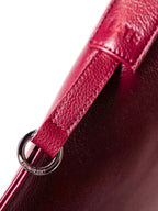 Close up of side of bag, showing silver clip ring hardware