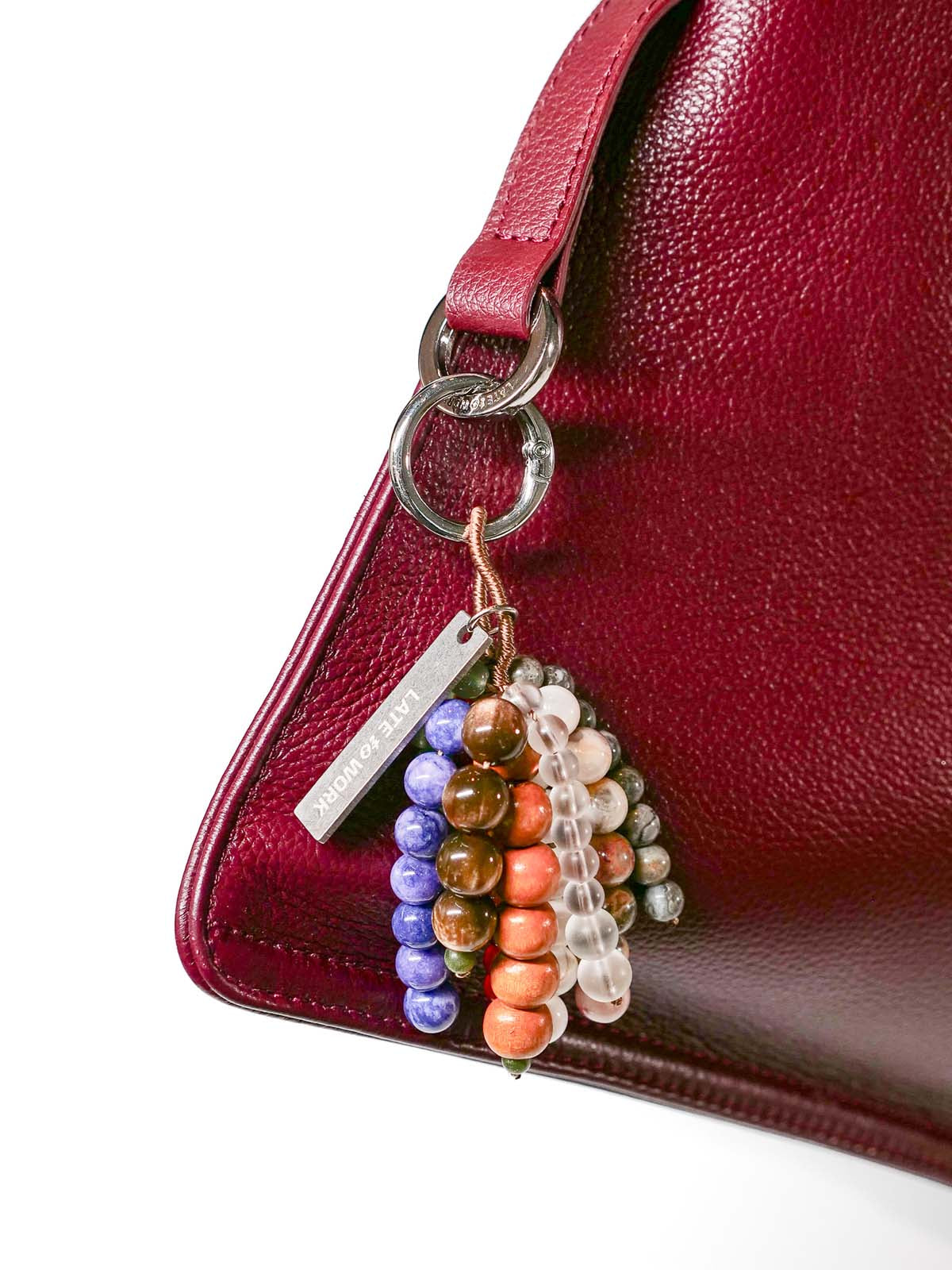 Close up of bag charm hanging on silver ring