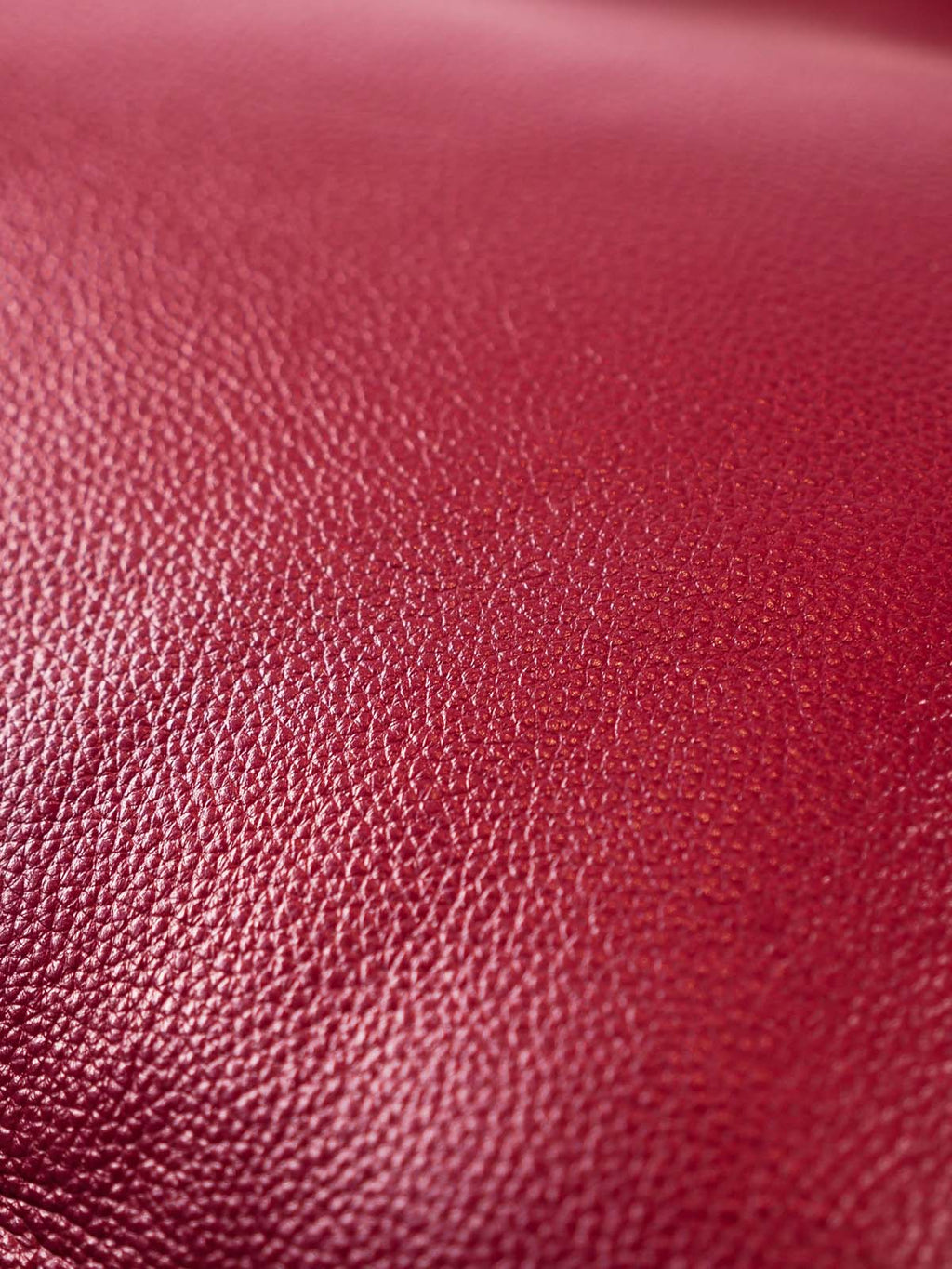 Close up burgundy top-grain leather texture