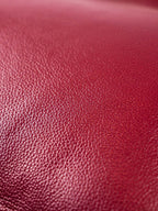 Close up burgundy top-grain leather texture