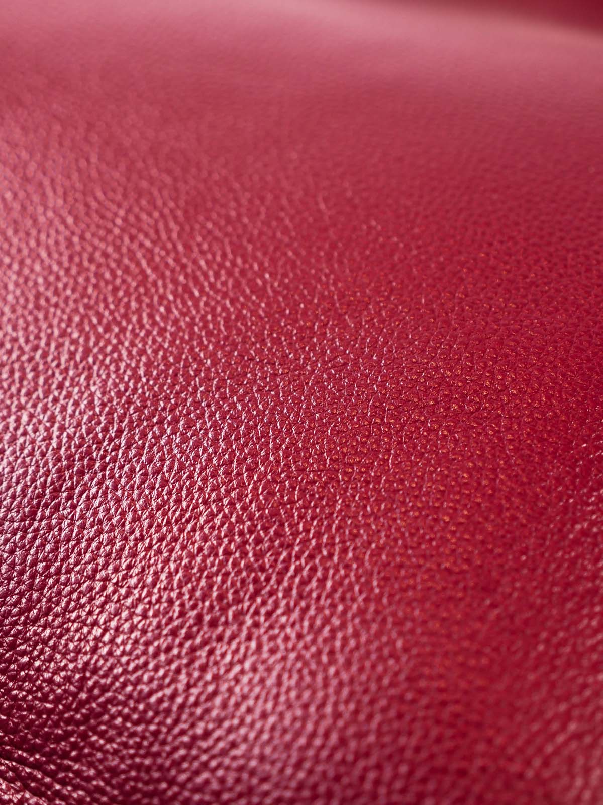 Close up burgundy top-grain leather texture
