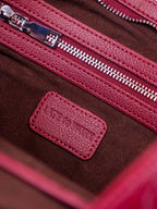 Close up interior pocket with 'Late to Work' logo tag
