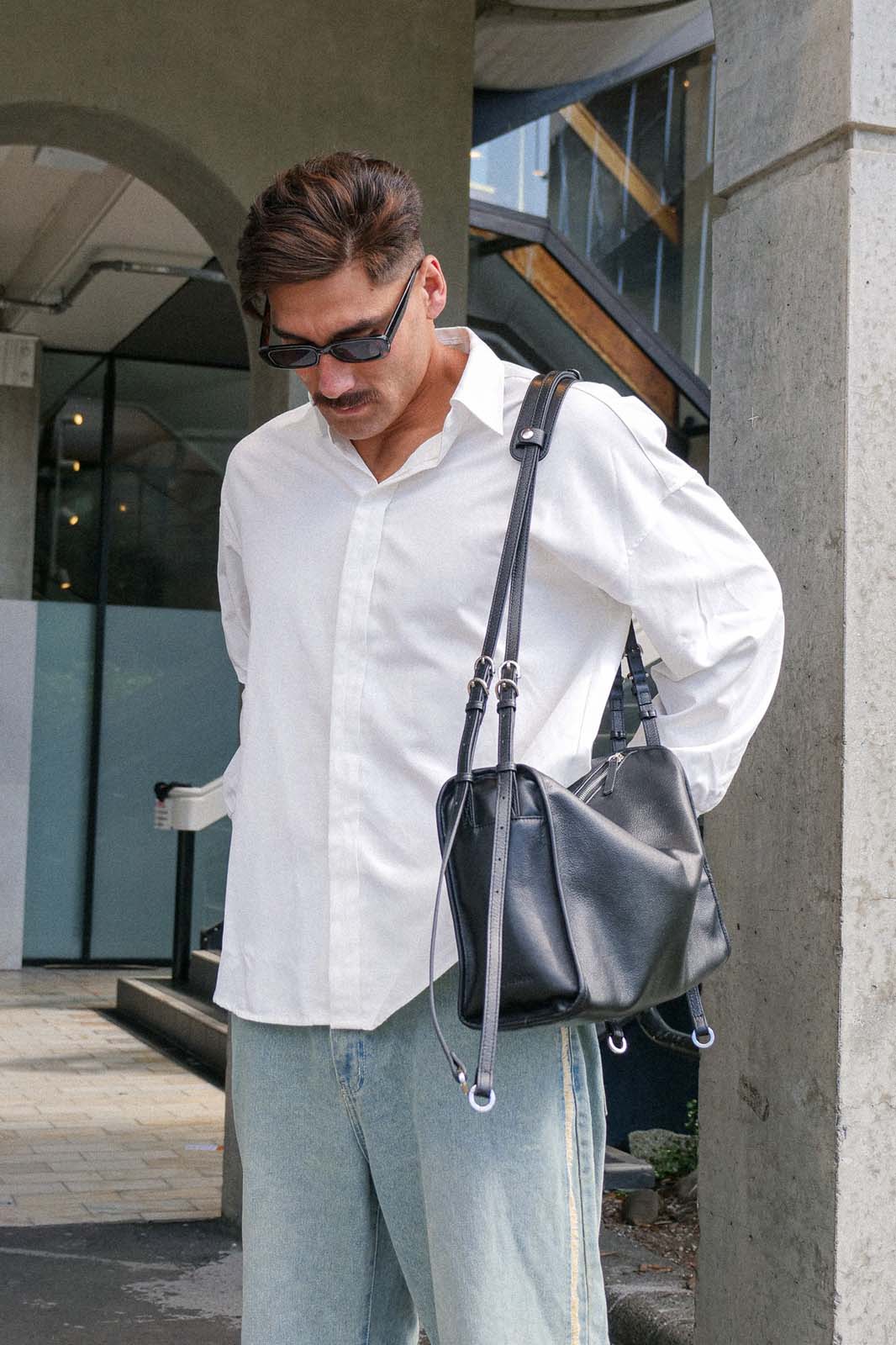 Black Willow Bag with shoulder pad attached worn on one shoulder