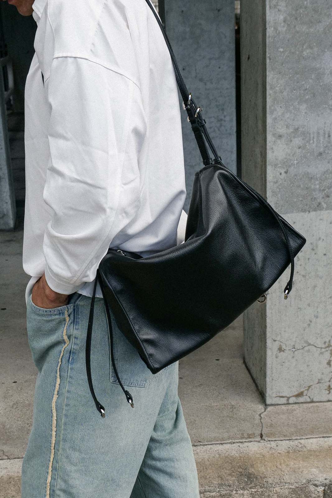Black Willow Bag worn on one shoulder, side view