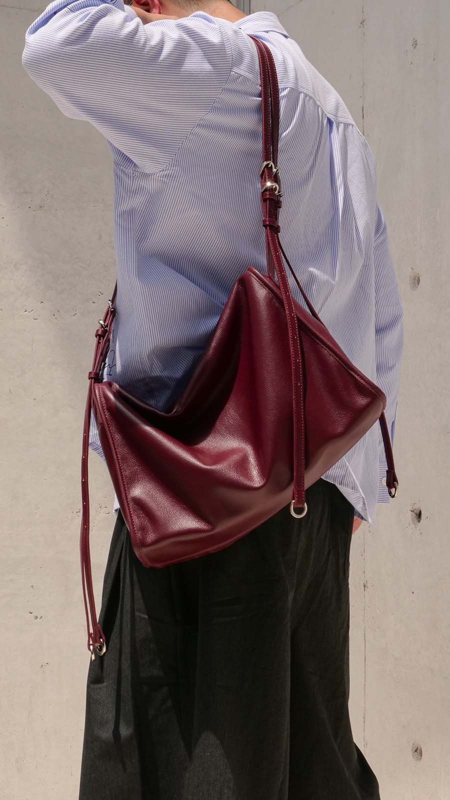 Close up Burgundy Willow Bag worn on one shoulder