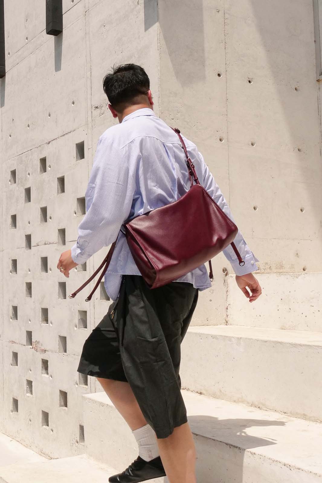 Burgundy Willow Bag worn crossbody on back