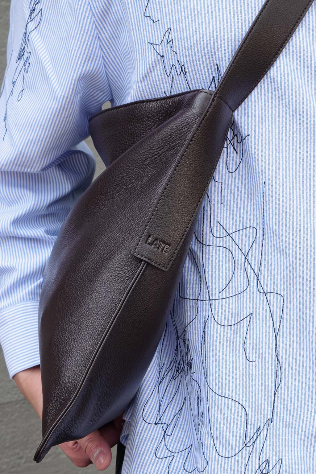 Close up of LATE embossed on bag strap