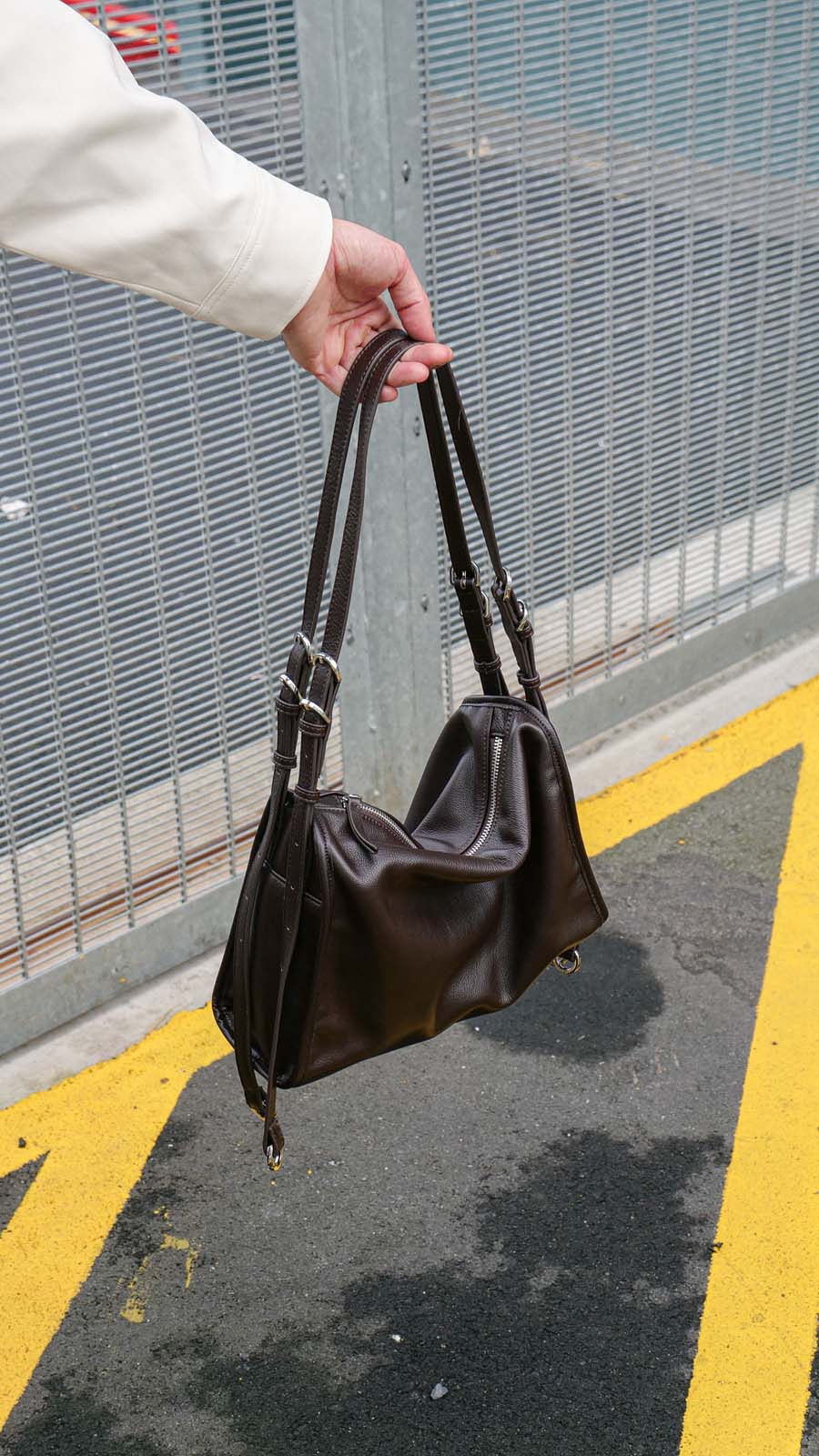 Brown Willow Bag held against concrete street