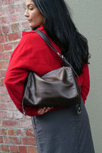 Small brown Willow Bag worn on one shoulder 