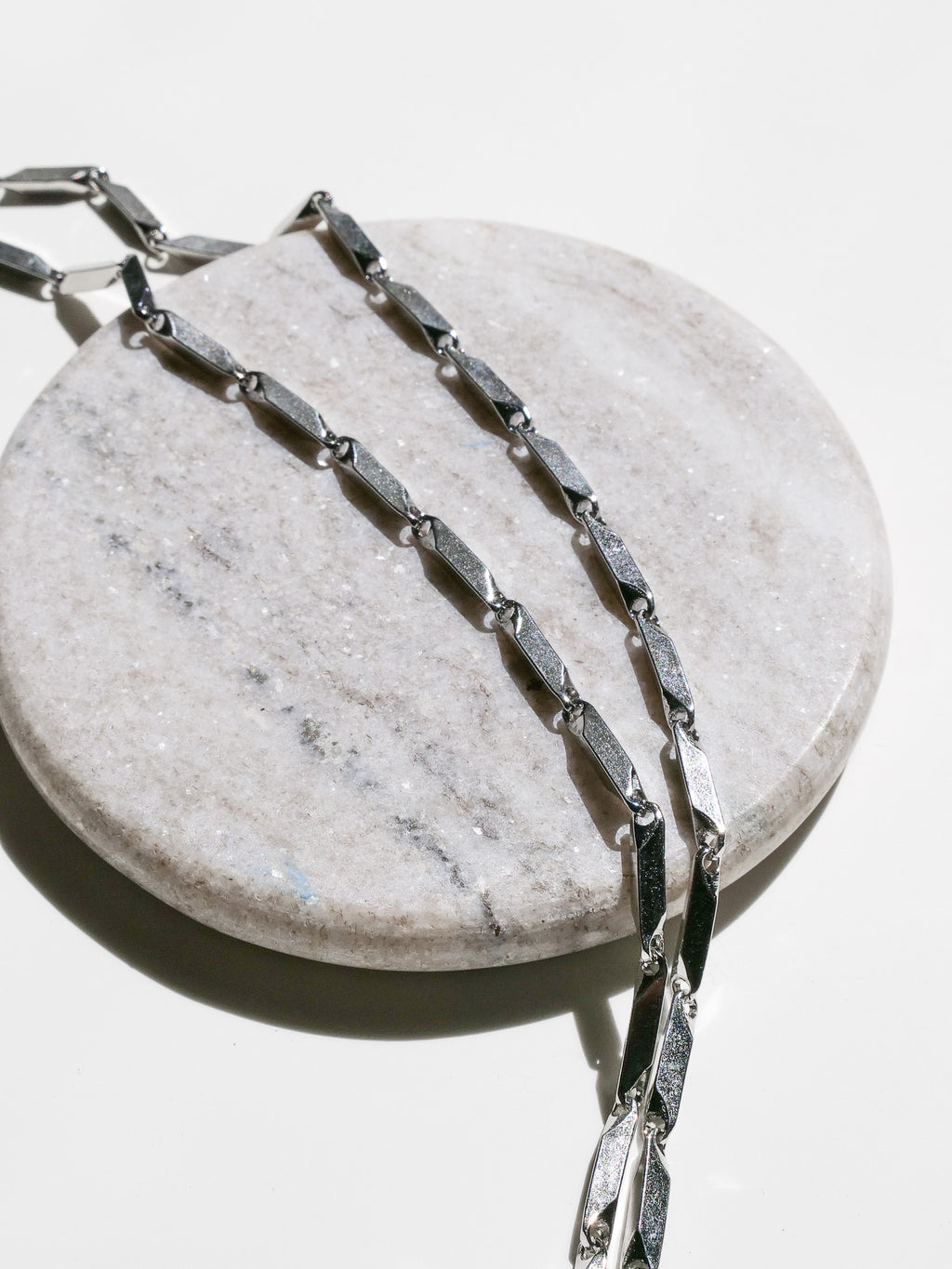 Prism Necklace close up showing stainless steel material