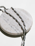 Prism Necklace close up showing stainless steel material