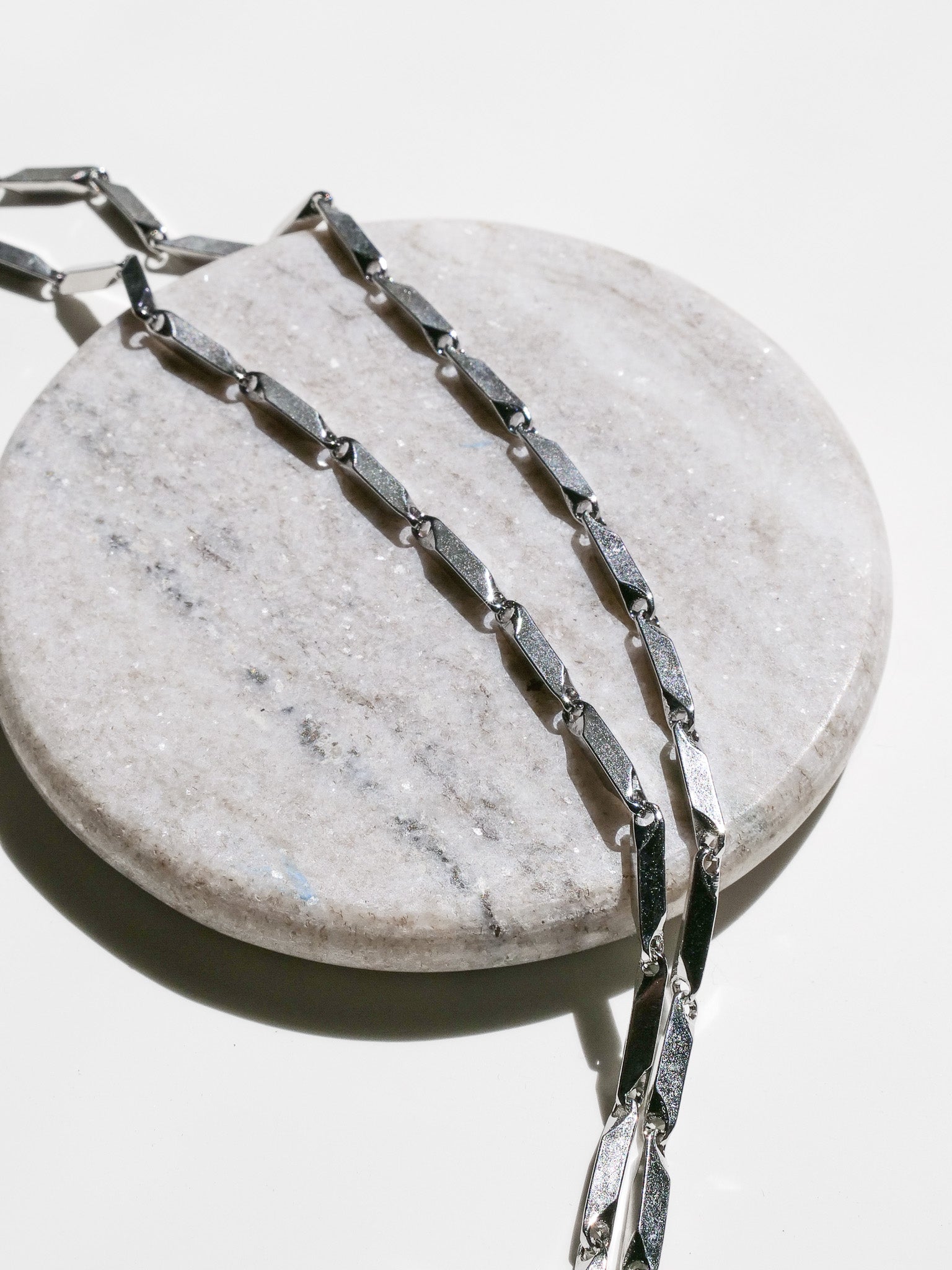 Prism Necklace close up showing stainless steel material