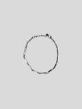Prism stainless steel bracelet on plain background
