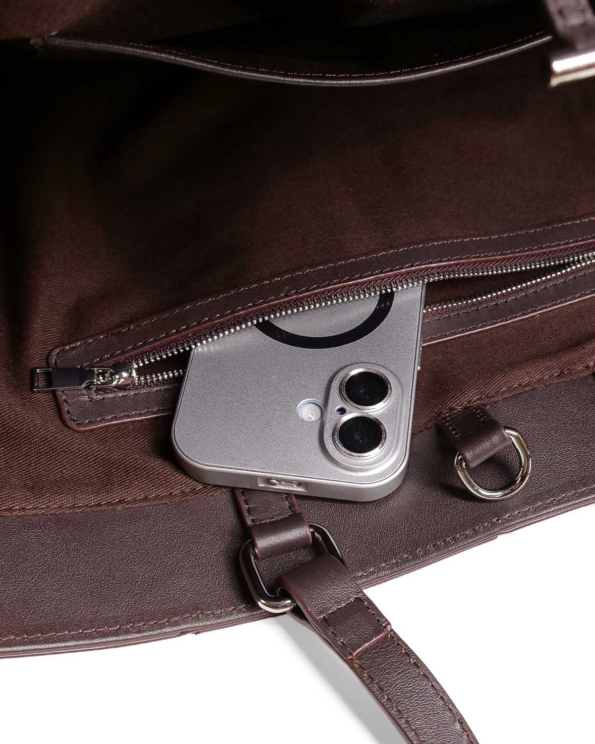 Interior zipped pocket with iPhone 17 inside