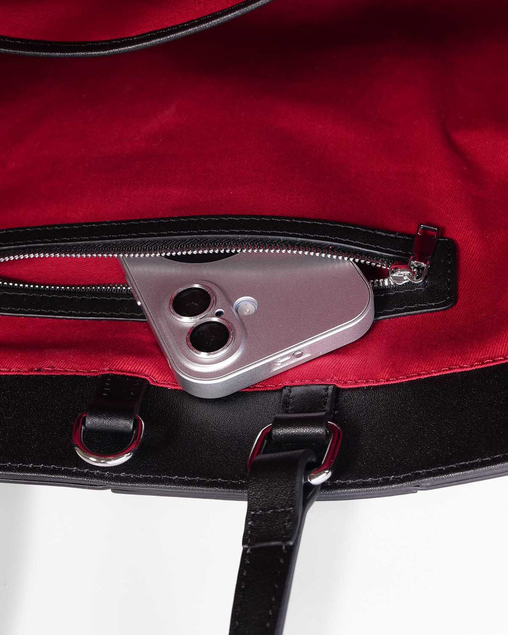 Close up of interior zipped pocket with iPhone 17 inside